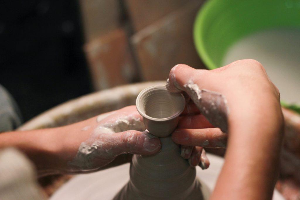 Craftsman's hands shaping ceramics
